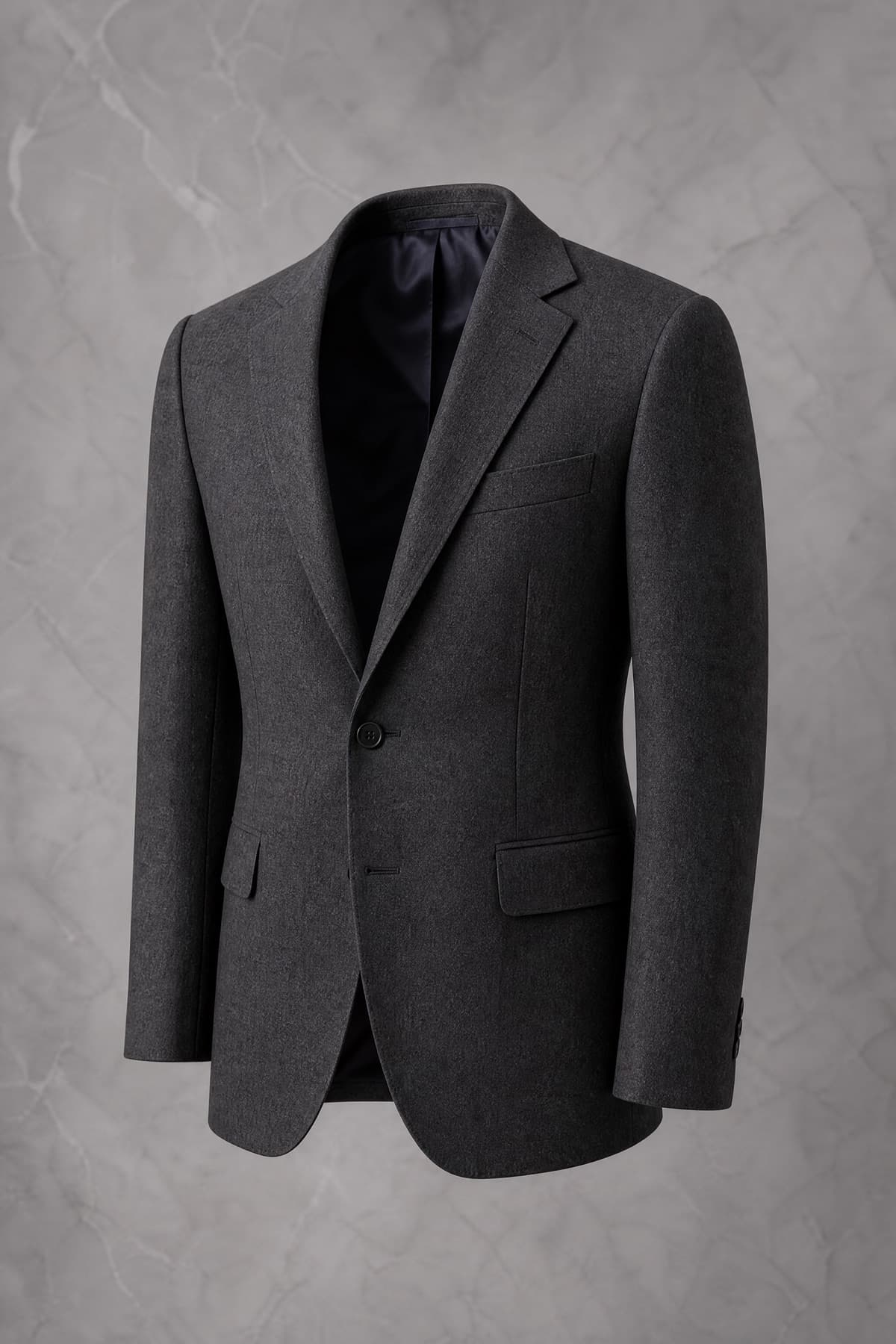 A charcoal full canvas tailored jacket holding its chest shape on an invisible form
