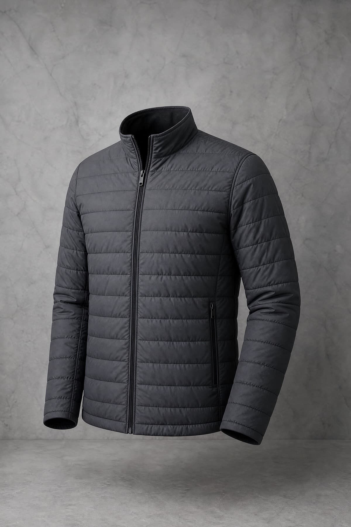 Quilted Light, graphite shell with fine horizontal quilting and low flat loft, on an invisible form