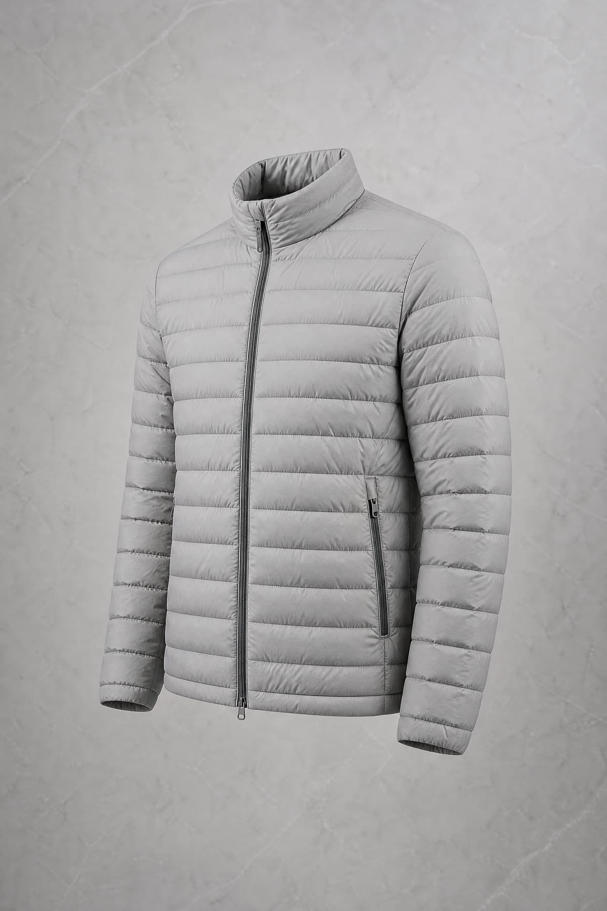 Down Light, light stone-grey ultralight shell with fine narrow baffles, on an invisible form