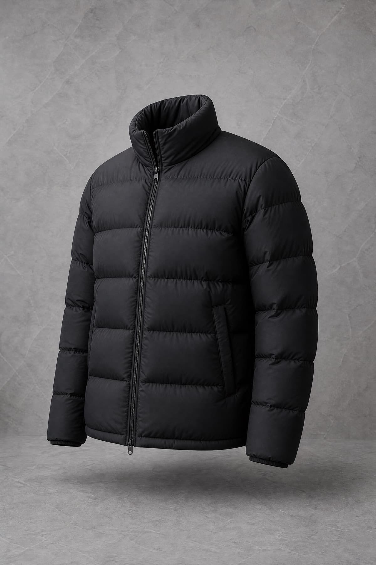 Down Standard, black goose-down jacket with deep evenly puffed baffles, on an invisible form