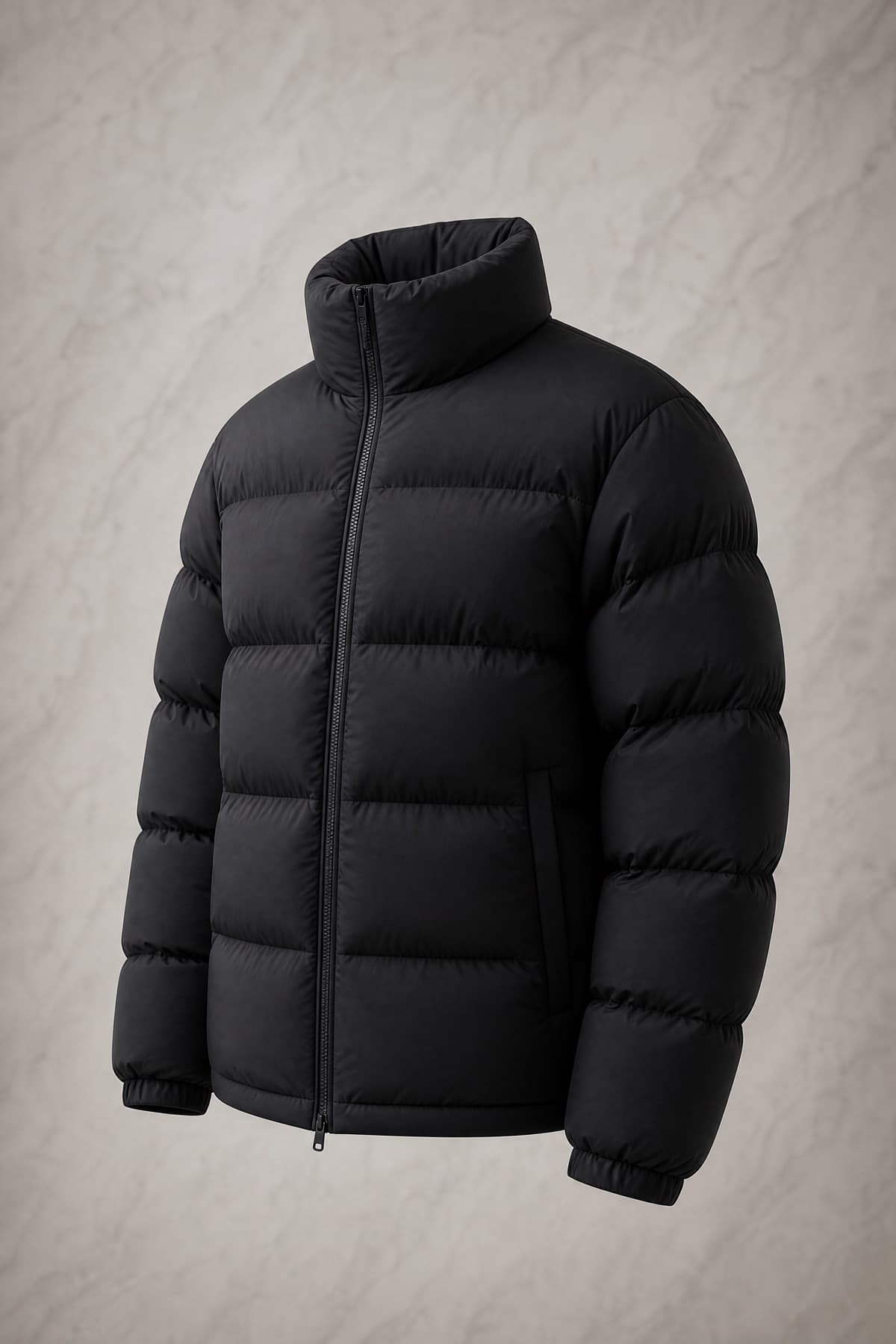 Down High Fill, matte black goose-down jacket with unusually tall round baffles, on an invisible form